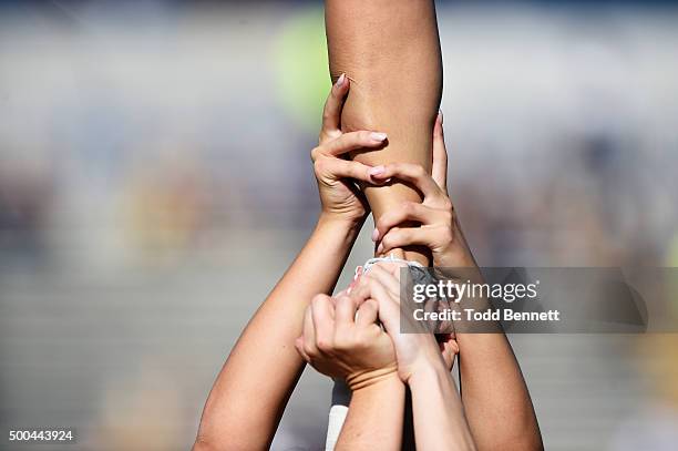 Cheerleaders for the Georgia Southern Eagles perform a stunt before their game against the South Alabama Jaguars on November 28, 2015 at Paulson...