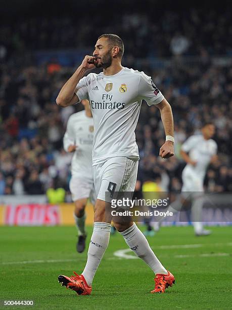 Karim Benzema of Real Madrid celebrates after scoring Real's opening goal during the UEFA Champions League Group A match between Real Madrid CF and...