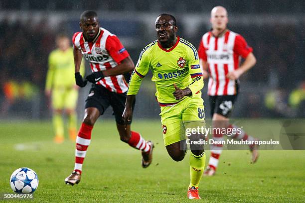 Seydou Doumbia of CSKA gets past Nicolas Isimat-Mirin of PSV during the group B UEFA Champions League match between PSV Eindhoven and CSKA Moscow...