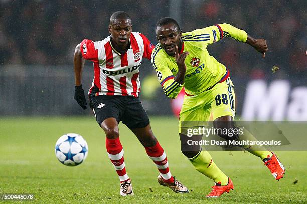 Seydou Doumbia of CSKA gets past the trackle from Nicolas Isimat-Mirin of PSV during the group B UEFA Champions League match between PSV Eindhoven...