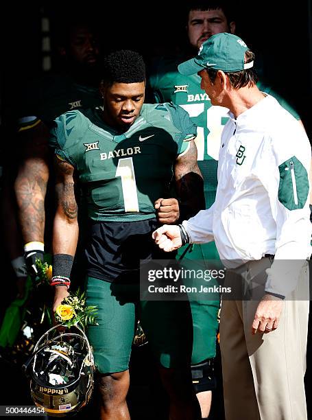 Corey Coleman of the Baylor Bears and head coach Art Briles meet before the Bears take on the Texas Longhorns at McLane Stadium on December 5, 2015...