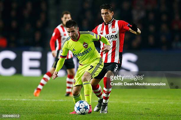 Zoran Tosic of CSKA battles for the ball with p3 of PSV during the group B UEFA Champions League match between PSV Eindhoven and CSKA Moscow held at...