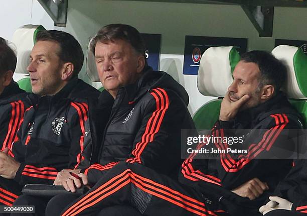 Assistant coach Albert Stuivenberg; Manager Louis van Gaal and Assistant Manager Ryan Giggs of Manchester United watch from the bench during the UEFA...