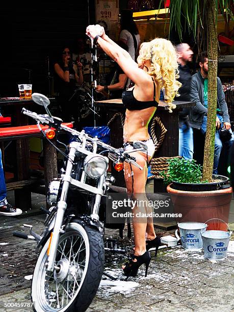 dancing. color image - harley davidson woman stock pictures, royalty-free photos & images