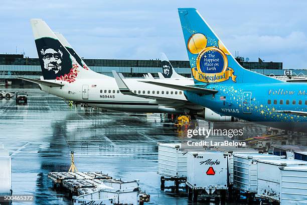 view at alaska airlines aircrafts from anchorage airport - anchorage airport stock pictures, royalty-free photos & images