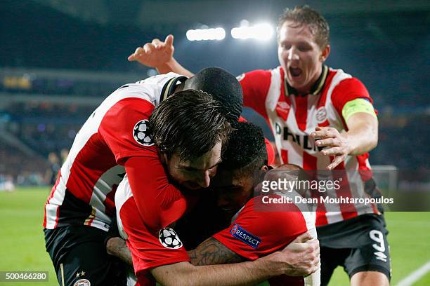 Davy Propper of PSV celebrates scoring his teams second goal of the game with teammates during the group B UEFA Champions League match between PSV...