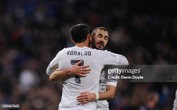 Cristiano Ronaldo of Real Madrid celebrates with Karim Benzema after scoring Real's 6th goal during the UEFA Champions League Group A match between...