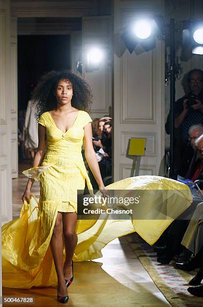 Model walks the runway during the fashion show 'Changer La Mode Pour Le Climat' as part of 21st session of Conference on climate change COP21 at...