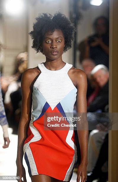 Model walks the runway during the fashion show 'Changer La Mode Pour Le Climat' as part of 21st session of Conference on climate change COP21 at...