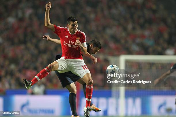 Benfica's midfielder Nicolas Gaitan vies with Atletico Madrid's midfielder Gabi during the match between SL Benfica and Club Atletico de Madrid for...