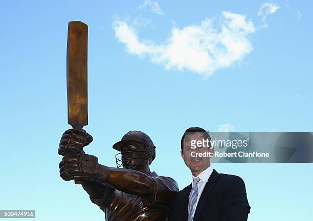 Former Australian cricketer Ricky Ponting poses with the the statue made in his honour, after it was unveiled at Blundstone Arena on December 9, 2015...