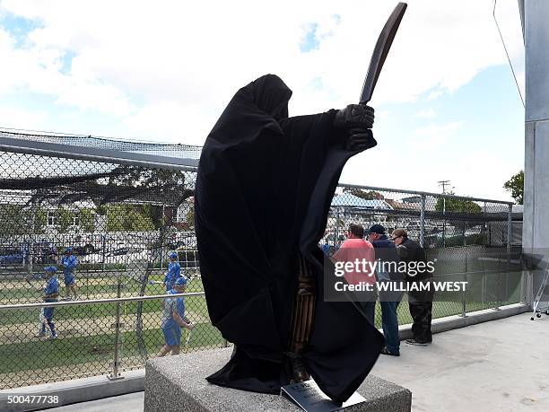 Statue of former Australian cricket captain Ricky Ponting is covered before being unveiled as the Australian team train during preparations for the...