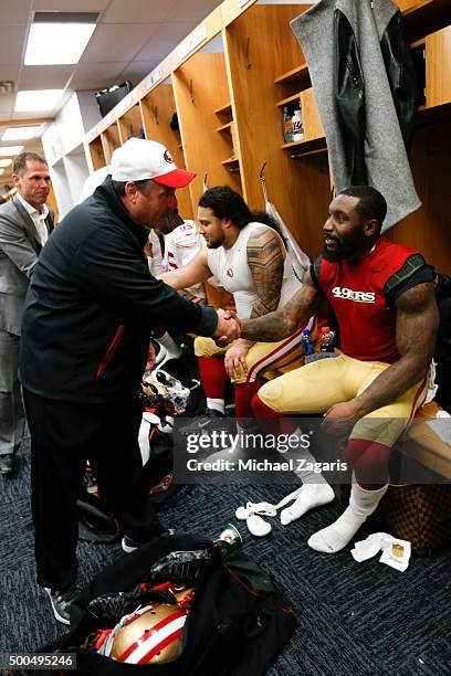 Head Coach Jim Tomsula and NaVorro Bowman of the San Francisco 49ers celebrate in the locker room following the game against the Chicago Bears at...