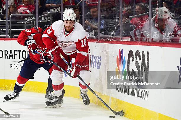 Joakim Andersson of the Detroit Red Wings controls the puck along the boards against the Washington Capitals in the second period during an NHL game...