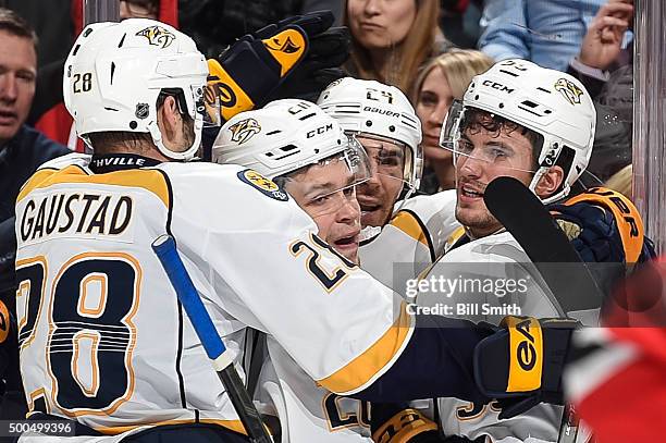 Eric Nystrom of the Nashville Predators celebrates with Paul Gaustad, Miikka Salomaki and Roman Josi after scoring against the Chicago Blackhawks in...