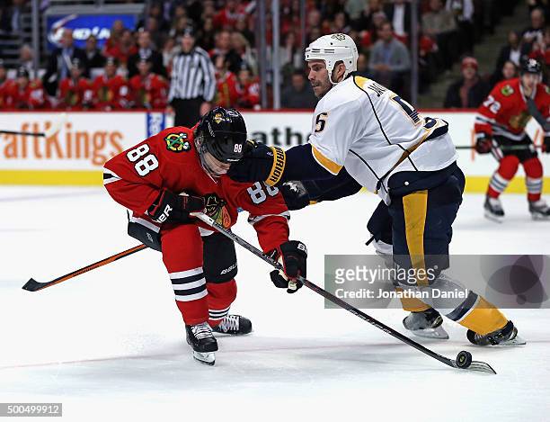 Barret Jackman of the Nashville Predators hits Patrick Kane of the Chicago Blackhawks in the head at the United Center on December 8, 2015 in...