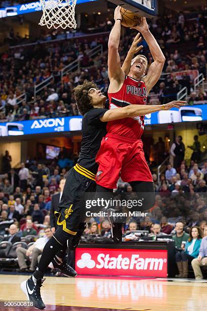 Anderson Varejao of the Cleveland Cavaliers fouls Mason Plumlee of the Portland Trail Blazers during the first half at Quicken Loans Arena on...