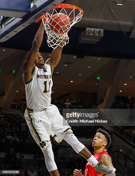 Demetrius Jackson of the Notre Dame Fighting Irish goes up for the dunk as Rayshaun McGrew of the Stony Brook Seawolves looks on at Purcell Pavilion...