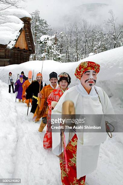 Women performing the 'Shichifukujin' Seven Lucky Gods march on during the Harukoma Dance at the World Heritage Gassho-Zukuri site on February 11,...