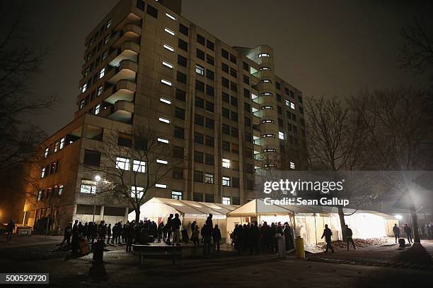 Migrants and refugees wait in the early hours outside the Central Registration Office for Asylum Seekers of the State Office for Health and Social...