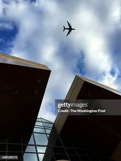Jumbo jet flies over Fairfax County Government Center on a fins approach to Dulles International Airport, December 3, 2015.