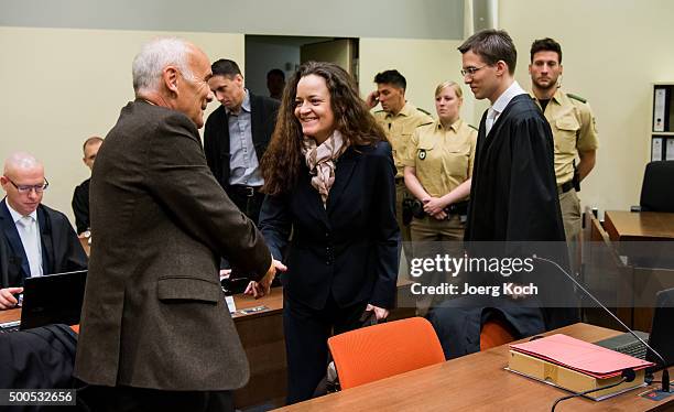 Beate Zschaepe, the main defendant in the NSU neo-Nazi murder trial greets her lawyers Hermann Borchert and Mathias Grasel for day 249 of the trial...