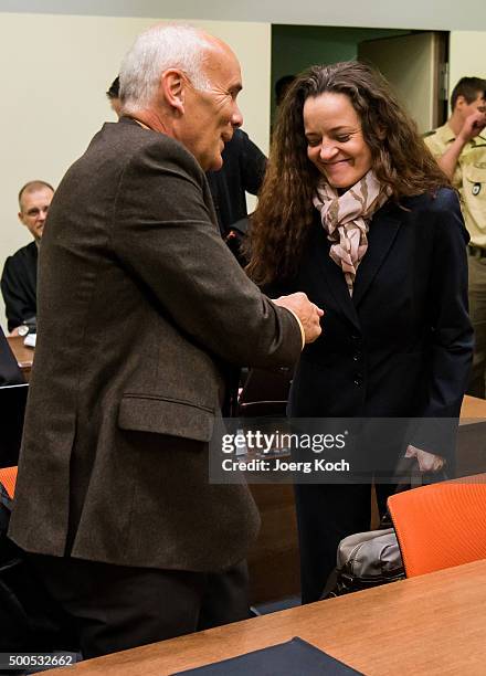 Beate Zschaepe, the main defendant in the NSU neo-Nazi murder trial greets her lawyer Hermann Borchert for day 249 of the trial at the...