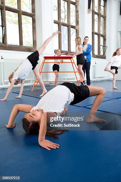 gymnastics at school - school gymnastics stock pictures, royalty-free photos & images