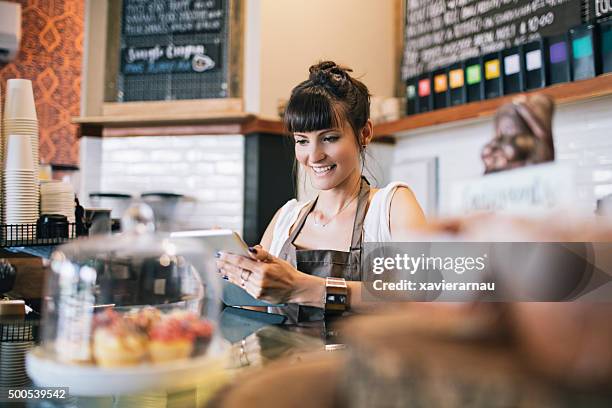 posting the new cafeteria breakfast deals on the social media - hipster australia stock pictures, royalty-free photos & images