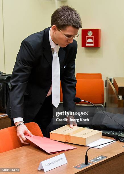 Mathias Grasel, lawyer of Beate Zschaepe, the main defendant in the NSU neo-Nazi murder trial, holds a box containing what is likely to be her...