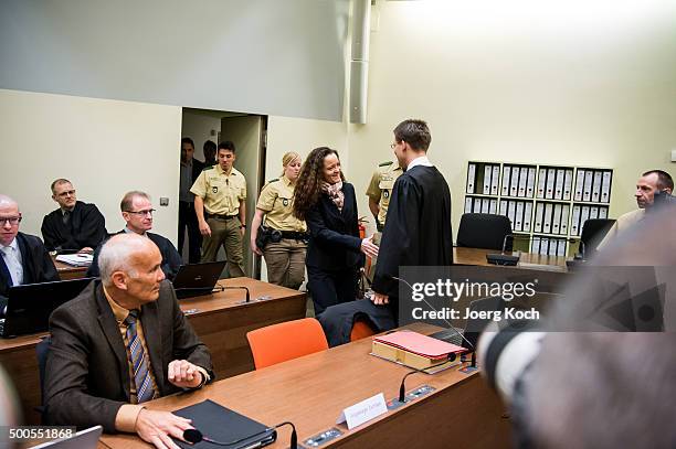 Beate Zschaepe, the main defendant in the NSU neo-Nazi murder trial greets her lawyers Hermann Borchert and Mathias Grasel for day 249 of the trial...