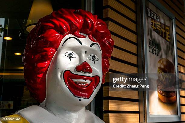 Smile face of a Ronald McDonald statue outside an McDonald's outlet. Ronald McDonald is a clown character used as the primary mascot of the...