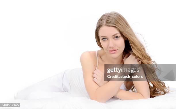 beautiful woman in bed - bed on white stock pictures, royalty-free photos & images