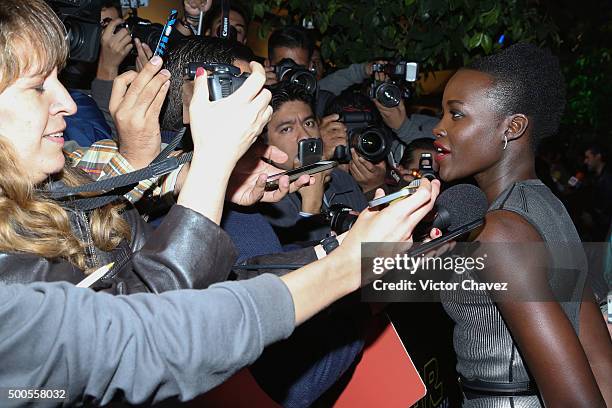 Actress Lupita Nyong'o speaks with the media during the "Star Wars: The Force Awakens" Mexico City premiere fan event at Cinemex Antara Polanco on...