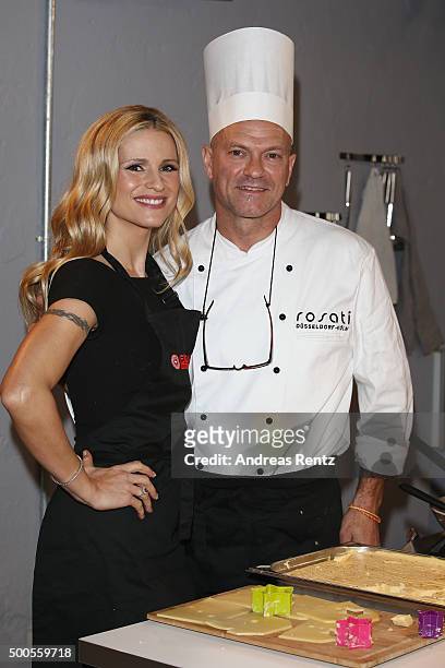 Michelle Hunziker and chief Massimo Sancillo attend a photocall to promote original swiss cheese, Schweizer Emmentaler AOP on December 9, 2015 in...