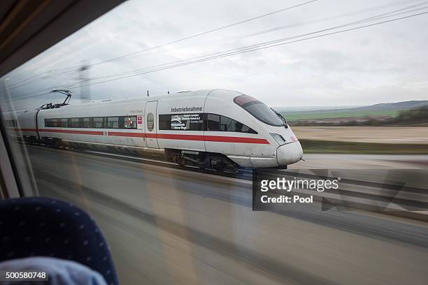 High-speed ICE train of German state rail carrier Deutsche Bahn travels on the newly-completed stretch between Erfurt and Leipzig on December 9, 2015...
