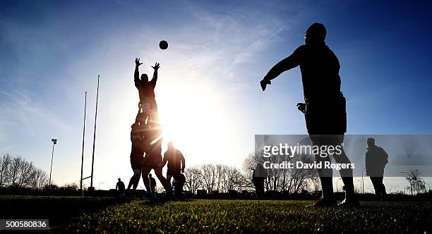Silhouette of the Saints practicing their lineouts during the Northampton Saints training session held at Franklin's Gardens on December 9, 2015 in...