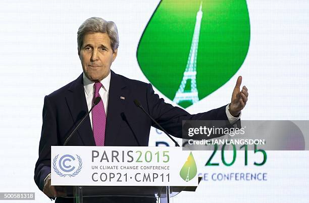 Secretary of State John Kerry gives a speech during a news conference at the COP21 Climate Conference in Le Bourget, north of Paris, on December 9,...