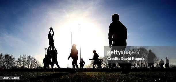 Silhouette of the Northampton Saints practicing their lineouts during the Northampton Saints training session held at Franklin's Gardens on December...