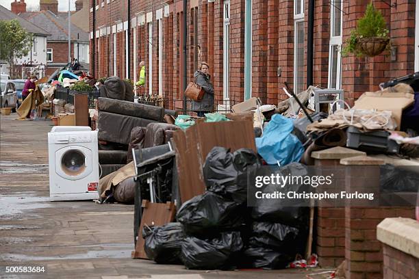 Water damaged possessions sit outside a flooded home in Carlisle after flooding created by Storm Desmond on December 9, 2015 in Carlisle, United...