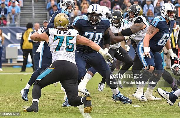 Chance Warmack of the Tennessee Titans blocks Jared Odrick of the Jacksonville Jaguars at Nissan Stadium on December 6, 2015 in Nashville, Tennessee.