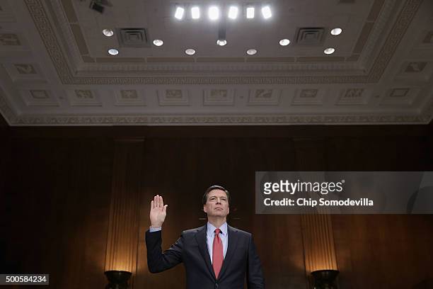 Federal Bureau of Investigation Director James Comey is sworn in before testifying to the Senate Judiciary Committee in the Dirksen Senate Office...