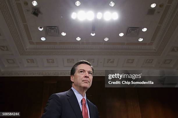 Federal Bureau of Investigation Director James Comey prepares to testify before the Senate Judiciary Committee in the Dirksen Senate Office Building...