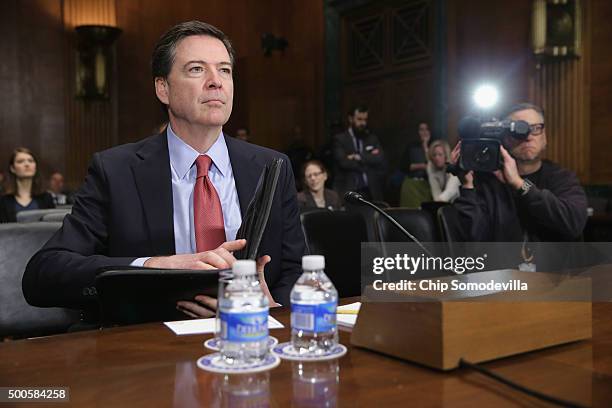 Federal Bureau of Investigation Director James Comey prepares to testify before the Senate Judiciary Committee in the Dirksen Senate Office Building...