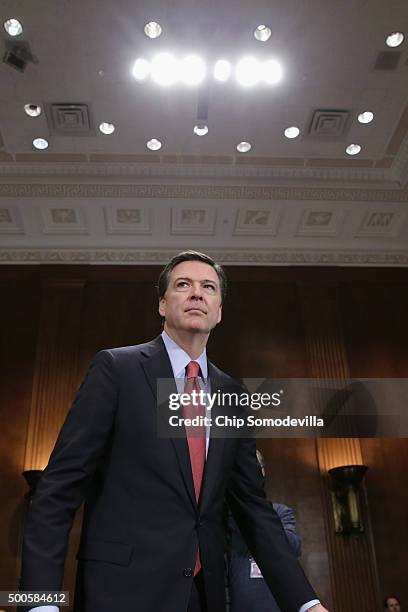 Federal Bureau of Investigation Director James Comey prepares to testify before the Senate Judiciary Committee in the Dirksen Senate Office Building...
