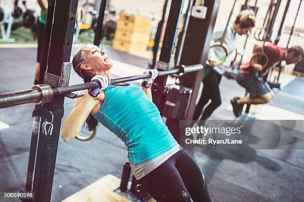 mature woman doing inverted rows - bodyweight training stock pictures, royalty-free photos & images