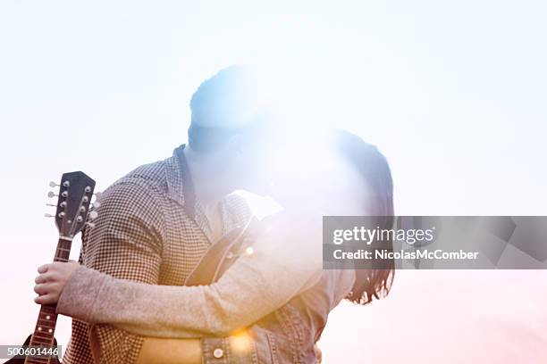 defocused dreamlike kiss in full colored lens flare - bokeh love stock pictures, royalty-free photos & images