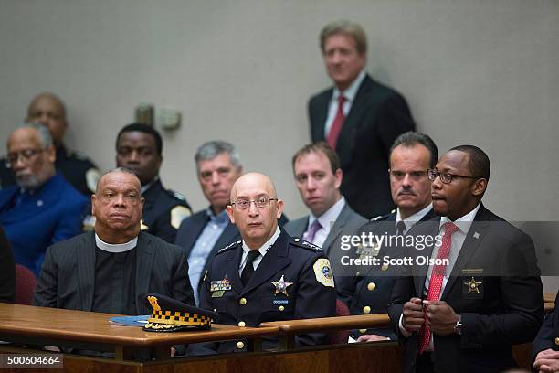 Acting Police Superintendant John Escalante listens as Chicago Mayor Rahm Emanuel addresses a special session of the City Council as his...