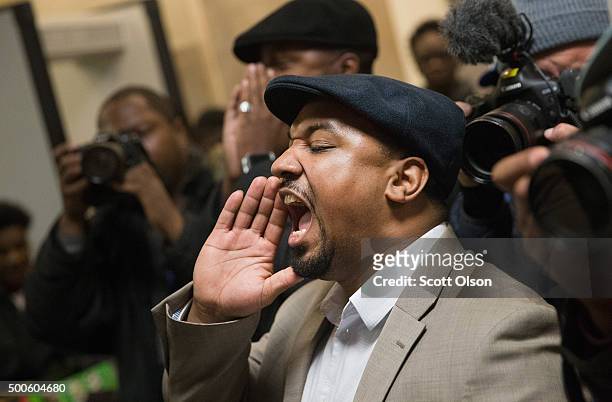Protestors demonstrate outside the city council chambers y as Chicago Mayor Rahm Emanuel addresses a special session of the City Council as his...