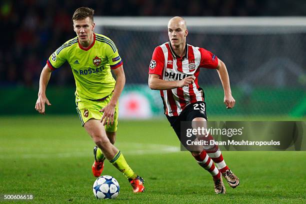 Jorrit Hendrix of PSV gets past the trackle from Pontus Wernbloom of CSKA during the group B UEFA Champions League match between PSV Eindhoven and...